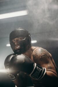 man in black helmet and brown leather jacket getting ready for comeback.