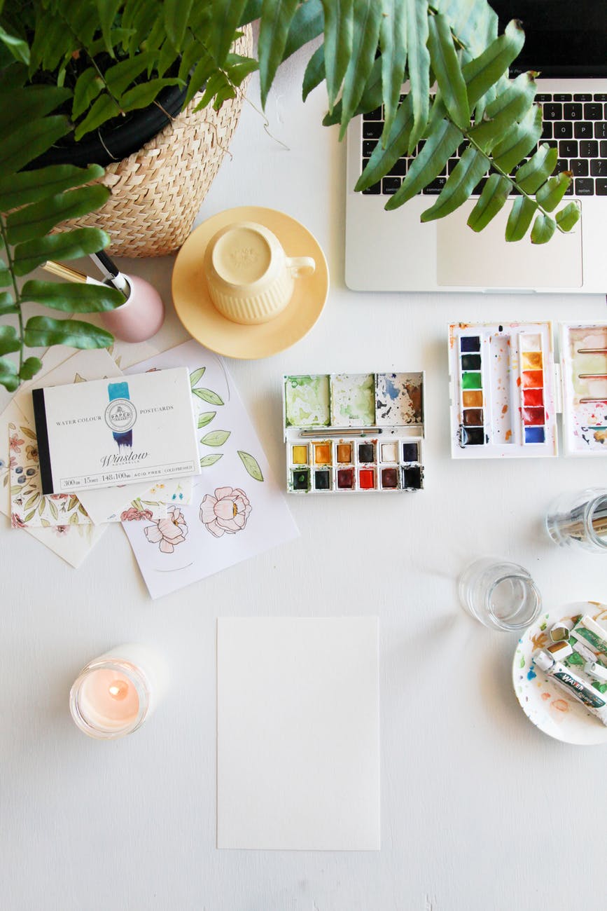 watercolor pallette on white desk top