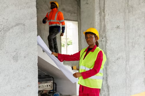Teachers in Jamaica building a house