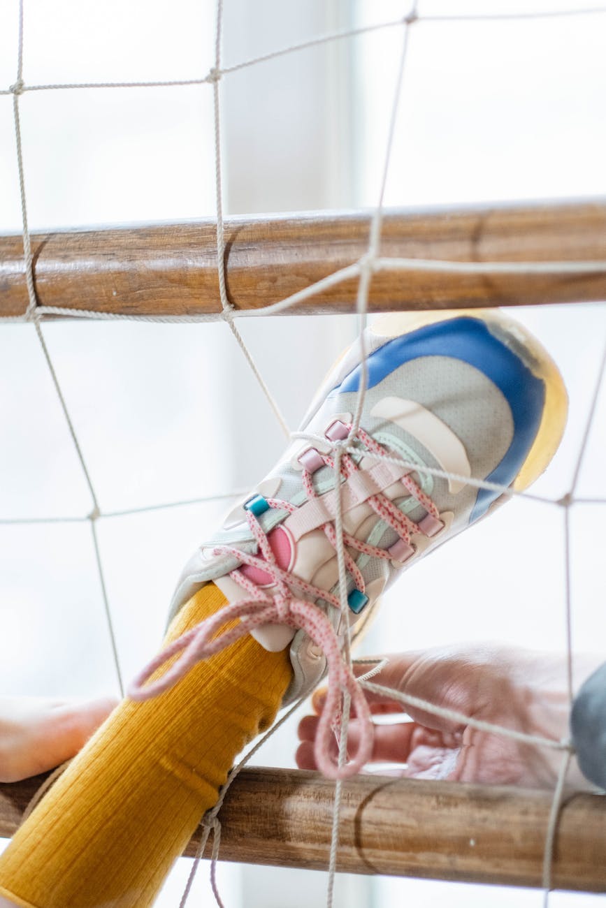 a person s feet stuck on a net