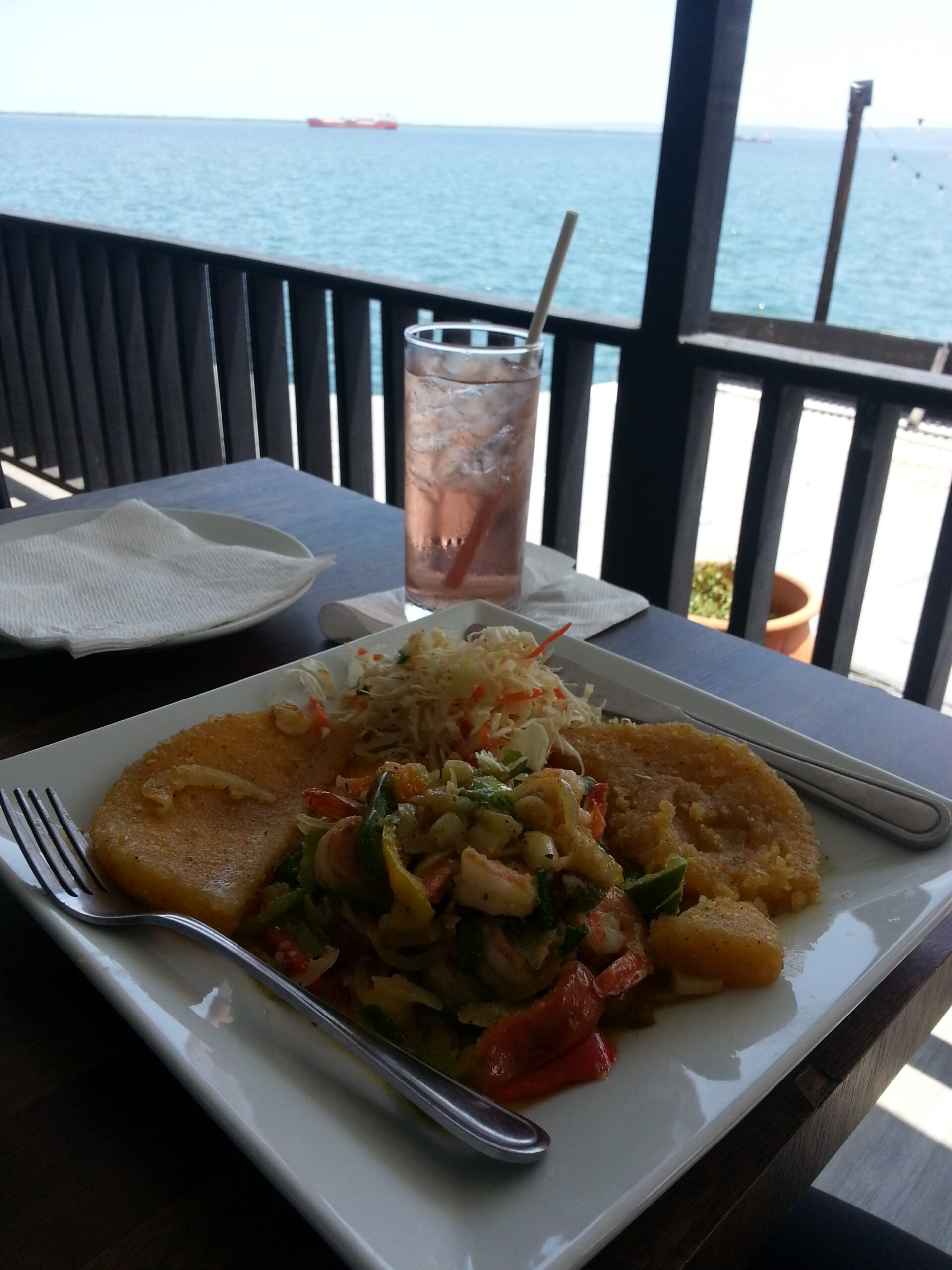 Garlic Shrimp and steamed bammy by the ocean