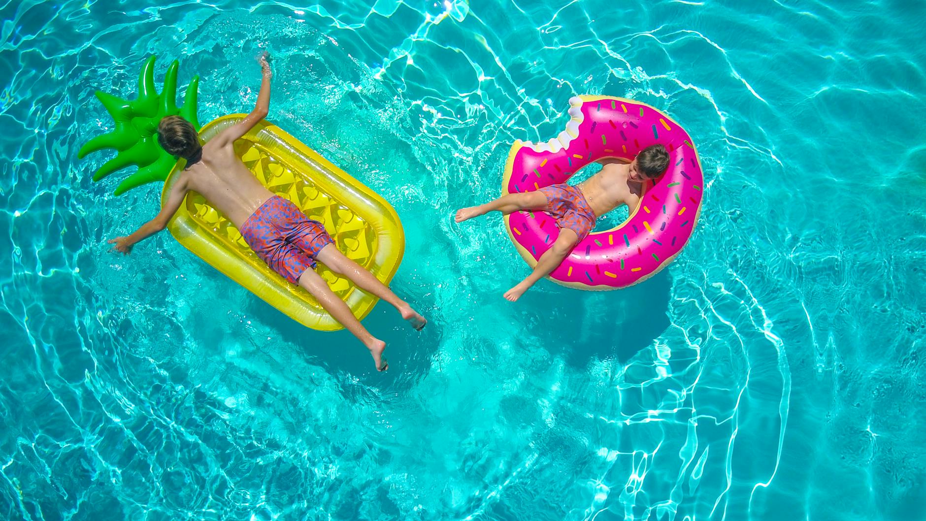 boys enjoying on the swimming pool