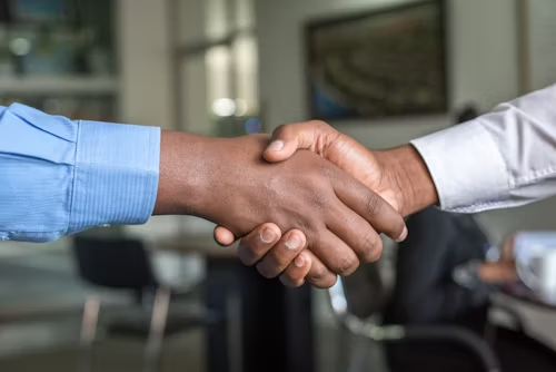 Jobs.
Picture showing a handshake.