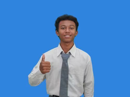 Jobs.
Young man in white shirt and blue tie, shows a thumbs up while smiling.