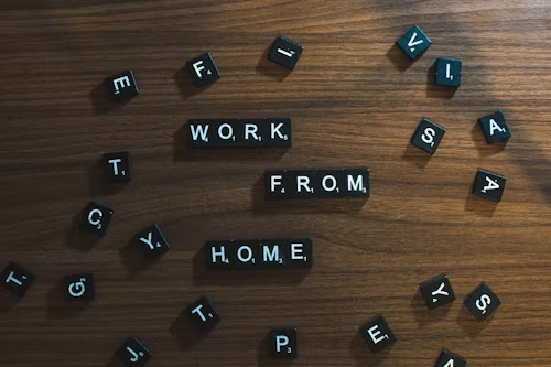 KPMG
Black and white word tiles spelling out 'work from home'